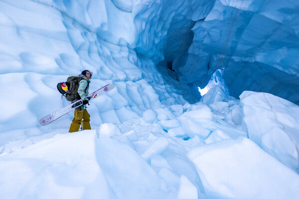 Michelle Parker carrying her skis through some crazy ice formations