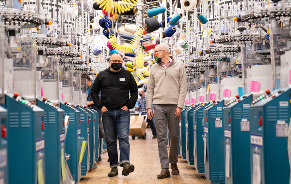 Jon and Ric walking through the Darn Tough Mill