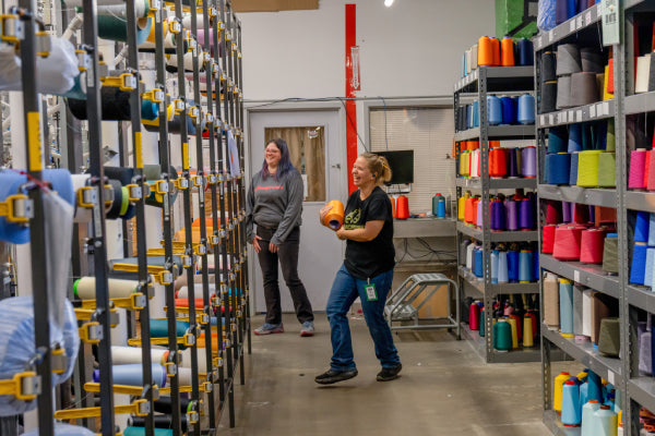 Darn Tough Employee looking for yarn at the mill