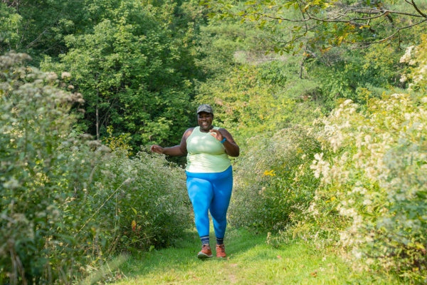 Mirna running on a grassy path in Vermont