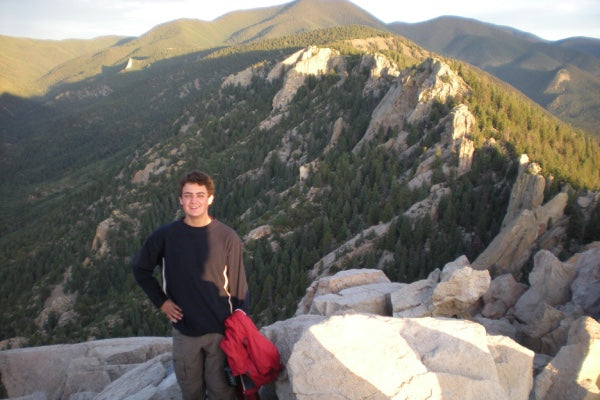 Ben standing on a mountain as part of a Boy Scout hike