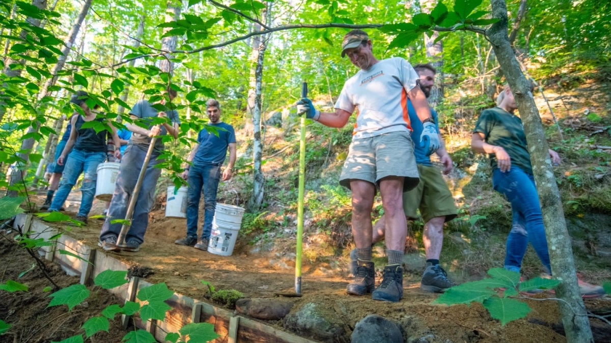 Volunteers working on fixing a mountain bike trail in Vermont