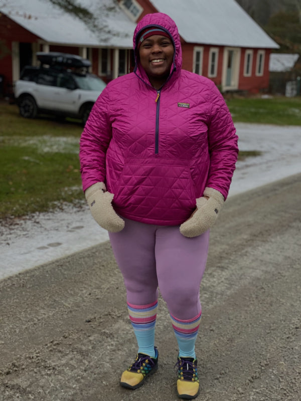 Grown up Mirna wearing snow gear for running, including merino wool socks