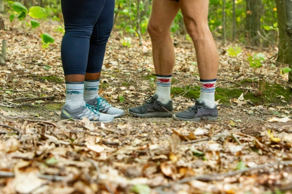 Two runners wearing the Pacer micro crew trail running socks
