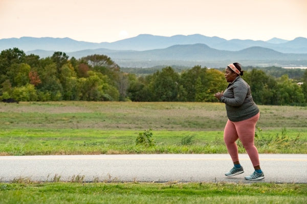 Mirna running down the road at sunrise