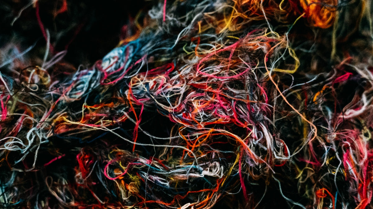 a pile of wool yarn fibers