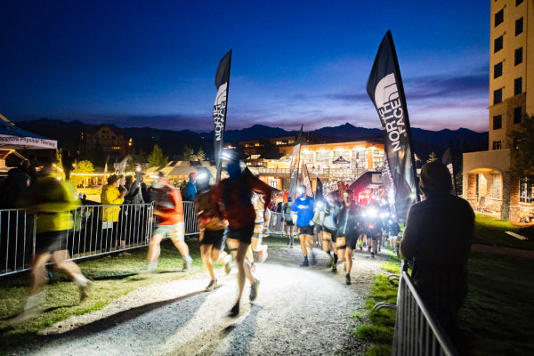 Runners crossing the Rut finish line