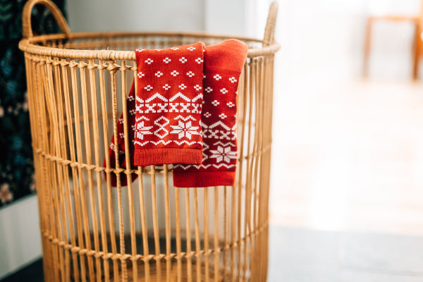 Darn Tough Shetland Crew Socks hanging over a basket