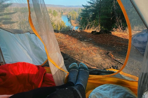 Sleeping in socks may be a good idea if you're camping in the spring, winter, or fall