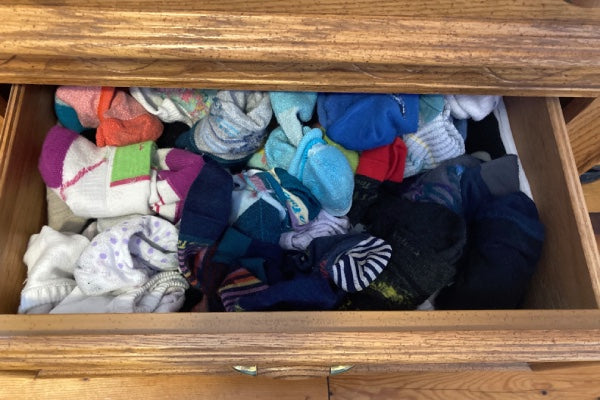 My messy sock drawer, with the socks all higgledy piggledy