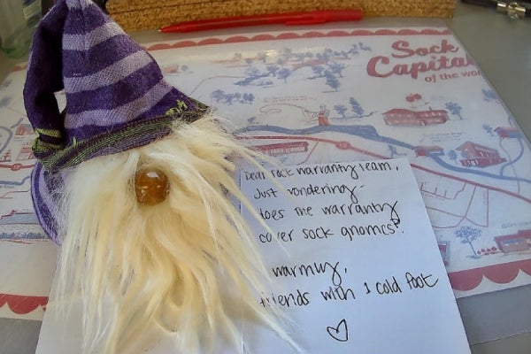An adorable gnome made out of Darn Tough socks, with a kind note from the sender