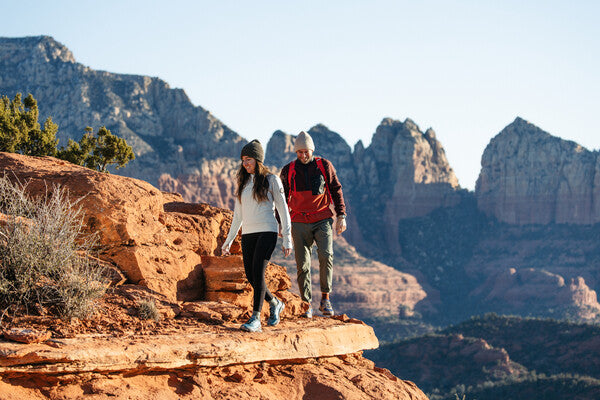 Two hikers on a trail in sunny Sedona, AZ