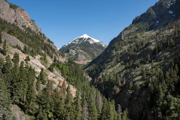 Dramatic view of a mountain valley from the million dollar highway in Colorado