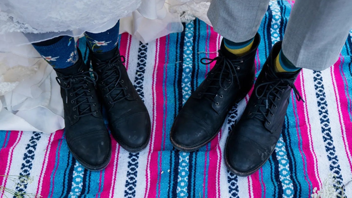 A bride's and groom's feet, both in Darn Tough Socks