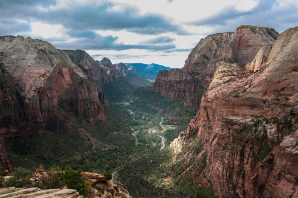 The view of angel's landing from above, showing the high canyon and lush valley