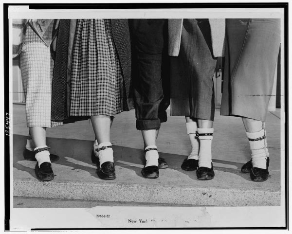 Old newspaper photo showing feet wearing bobby socks