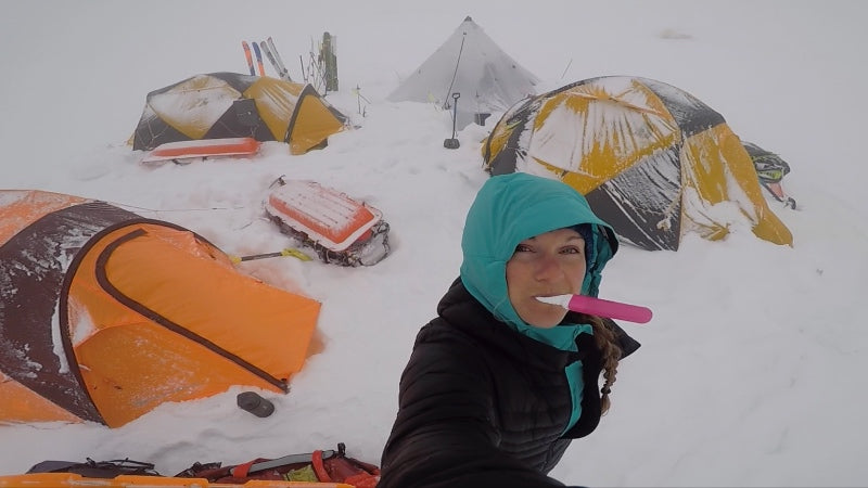Michelle Parker at a ski base camp, brushing her teeth