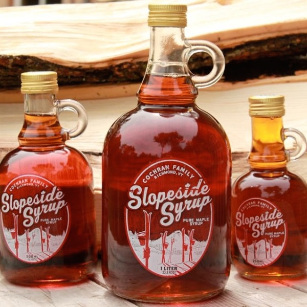 Jars of slopeside syrup maple syrup