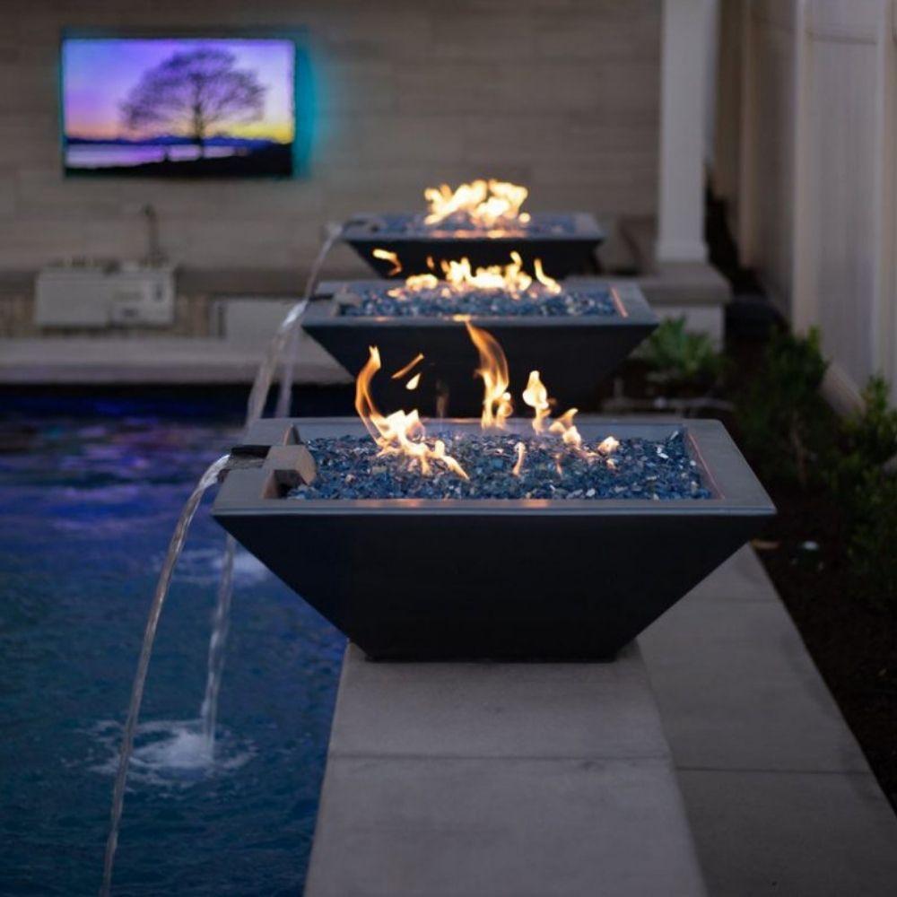 water and fire bowls arranged along a pool feature wall for dramatic effect.