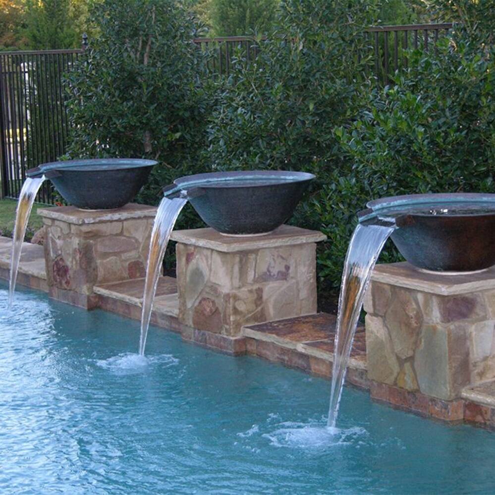 Three water bowls with waterfalls into a lovely pool. The three bowls are perfectly balanced along a pool feature wall.