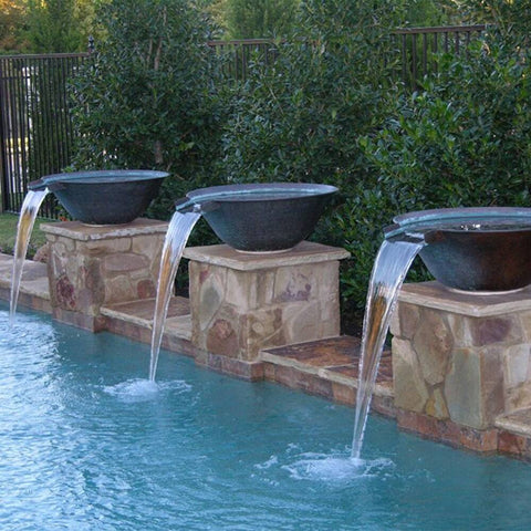 Three elegantly arranged water bowls above a pristine pool, creating a harmonious and sophisticated outdoor ambiance.