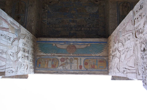 Fig 2. A winged sun disk on the underside of a lintel from the temple of Egyptian King Rameses III (date of reign c. 1184–1153 BC) at Medinet Habu near Luxor.