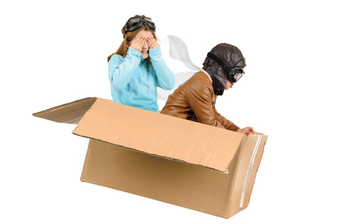 Kids playing in cardboard box