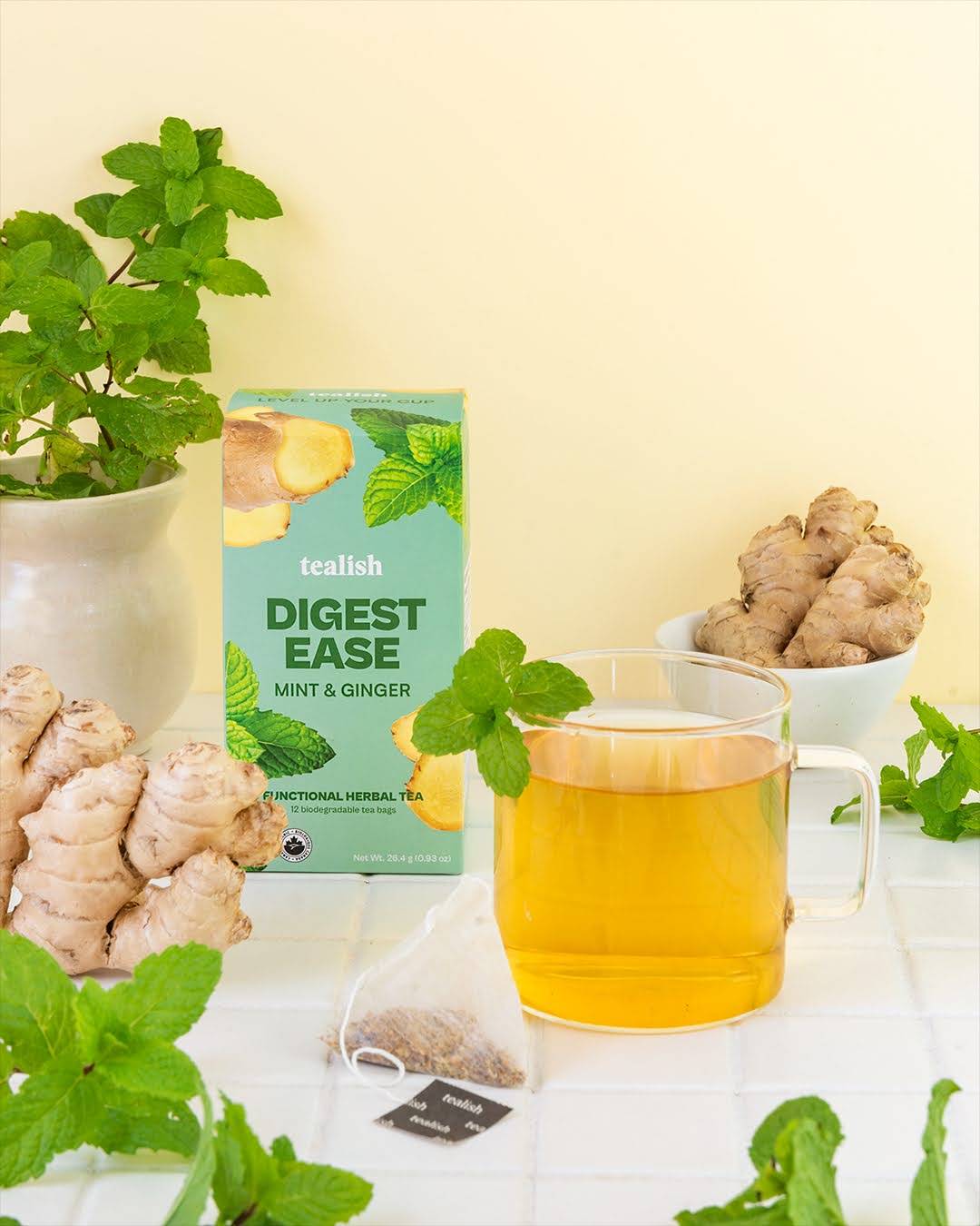 digest ease tea bags with cup of tea and fresh mint