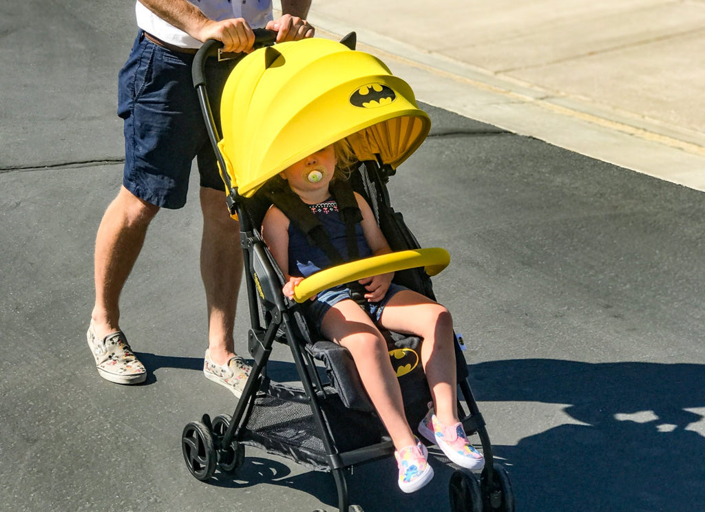 kids embrace batman stroller