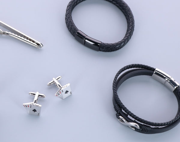 cufflinks, leather bracelets, and a tie bar