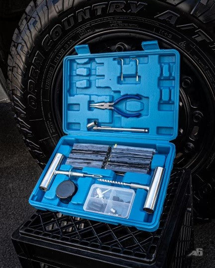 Agency tire repair kit opened, showing tools
