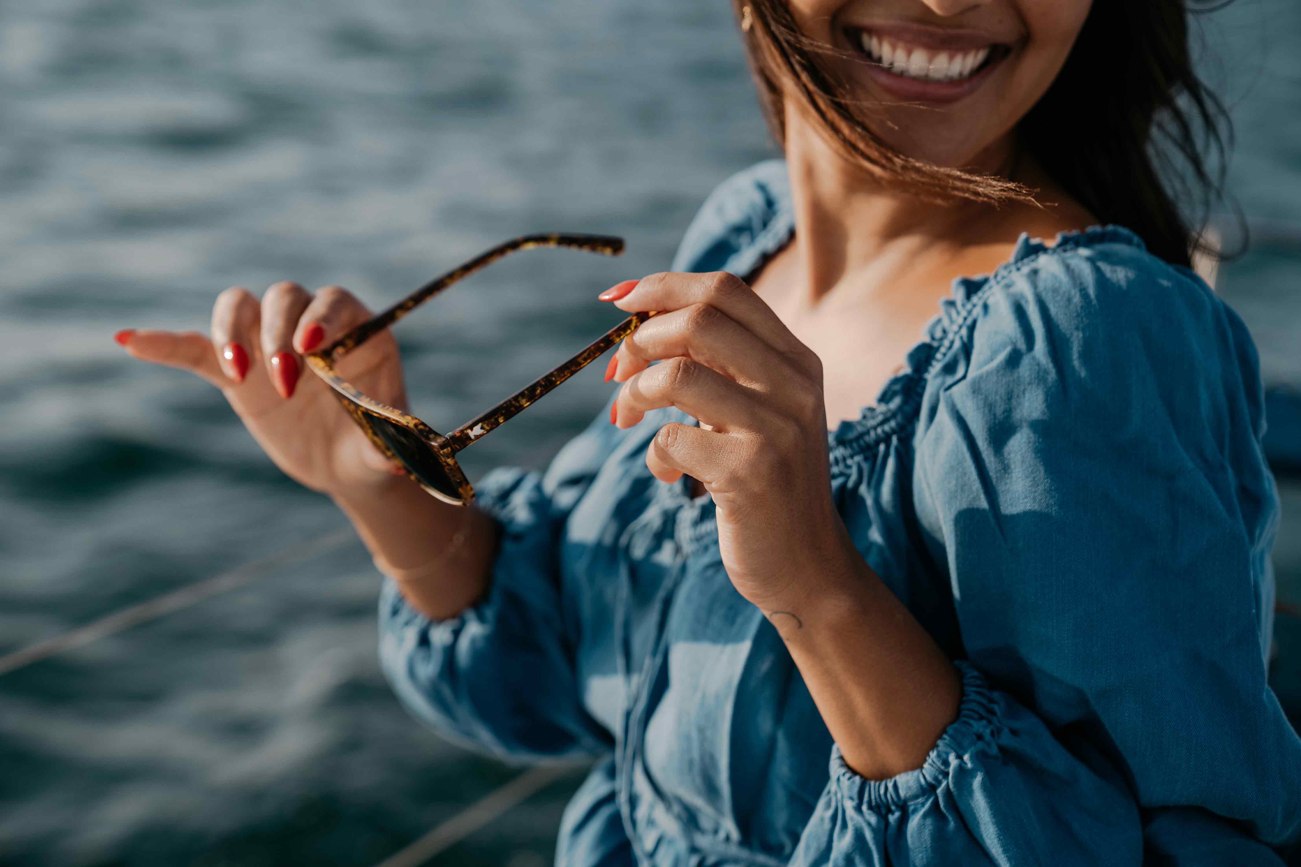 Girl on a boat wearing Pacific Palisades Sunglasses