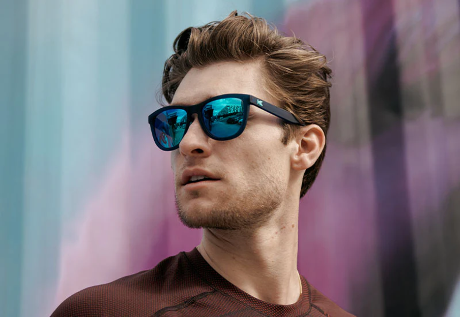 Man wearing blue Knockaround Premiums Sport sunglasses