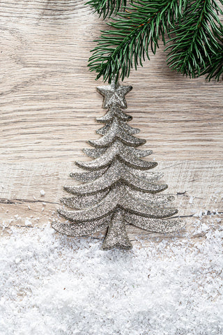 Metal Christmas tree on wooden background
