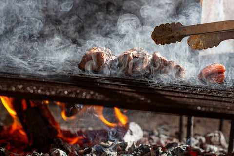 Smoking meat on a BBQ Smoker