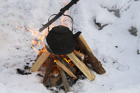 Fire pit with saucepan over