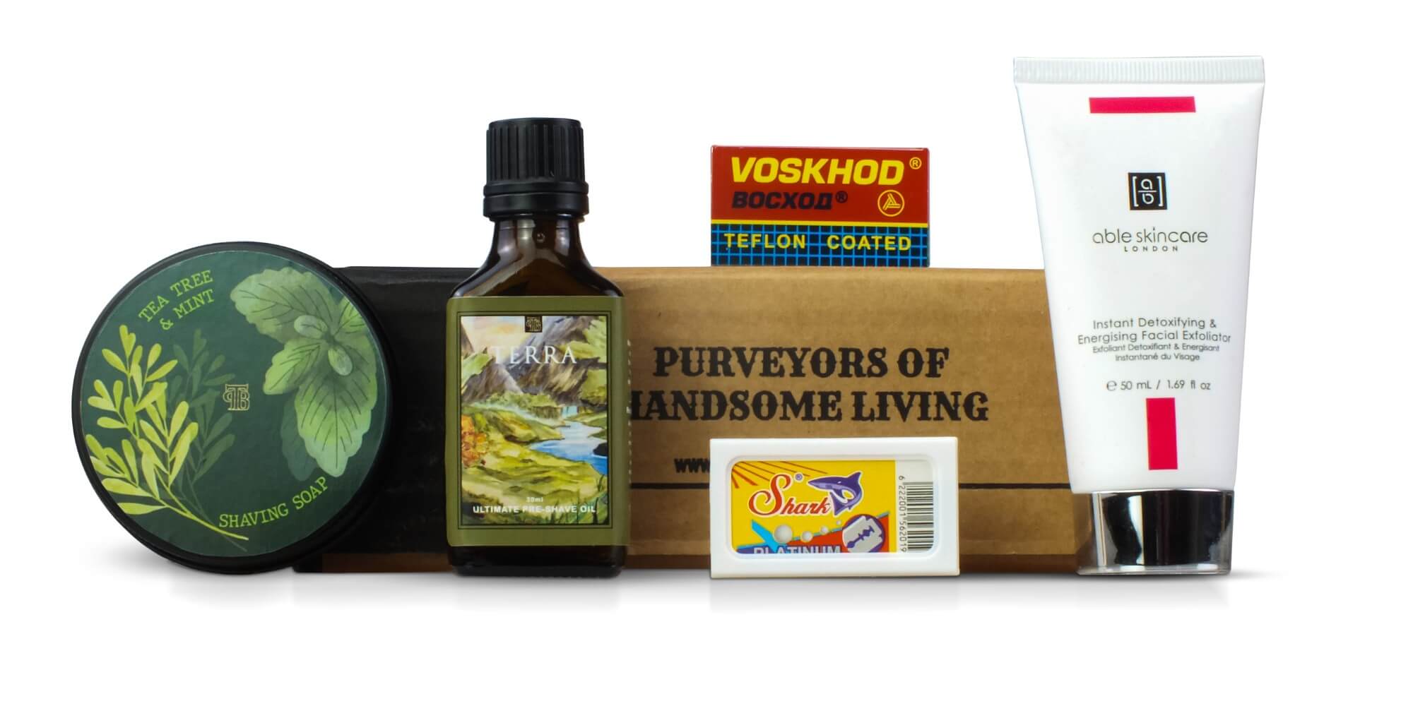 Augseptember 2023 subscription box featuring tea tree and mint shaving soap, terra pre-shave oil, pre-shave facial exfoliator and razor blades