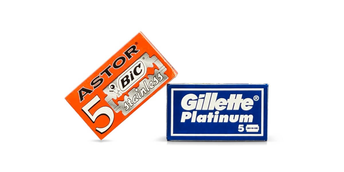 BIC Astor and Gillette Platinum Double-Edge Replacement Razor Blade Packs on a white background