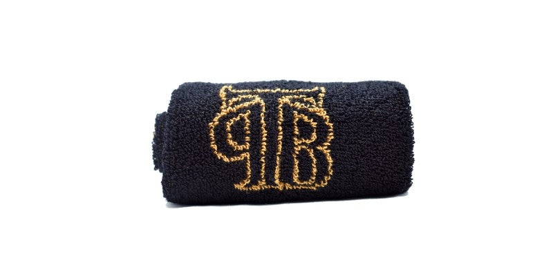 Black and gold shaving towel with TPB logo