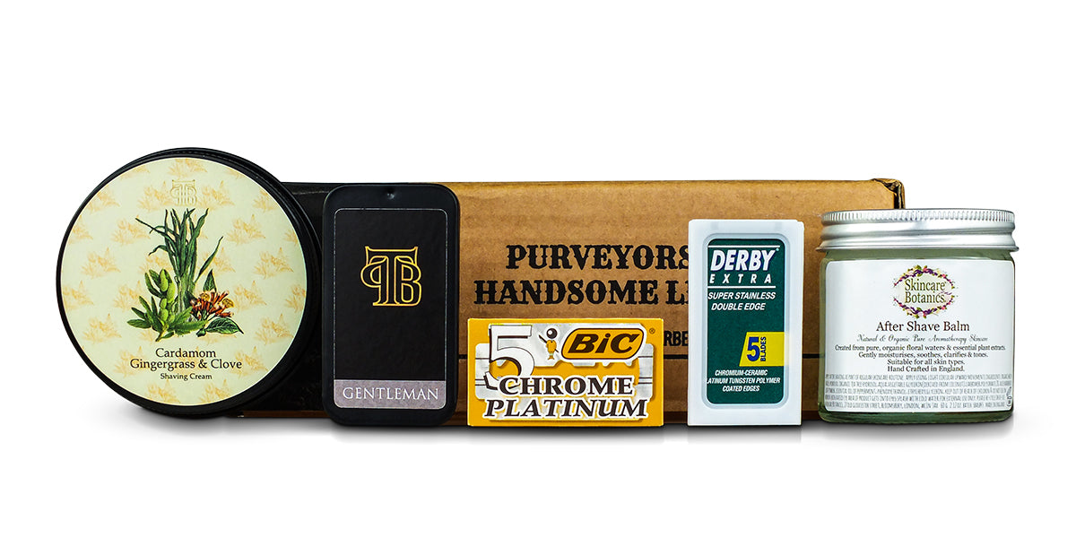 The May/June23 Shaving Subscription Box from The Personal Barber featuring Cardamom Shaving Cream, After Shave Balm, Gentleman Solid Cologne and replacement double-edge razors