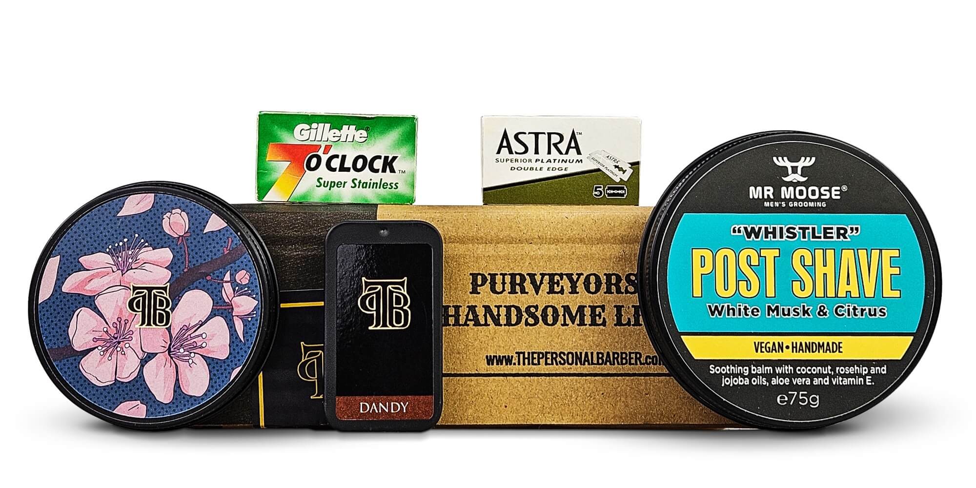 FebMarch2024 shaving subscription renewal box from The Personal Barber Shaving Club featuring shaving soap, post-shave balm, solid cologne and DE razors