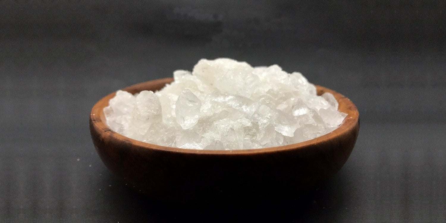 shaving alum crystals in a bowl