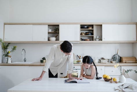 Father daughter in the kitchen