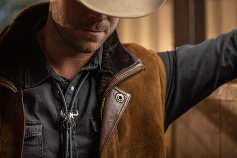 Man wearing Bola 1900 Sterling Buffalo Skull bolo tie