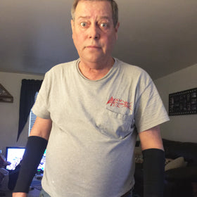 funny guy wearing skin guards forearm sleeves for thin skin