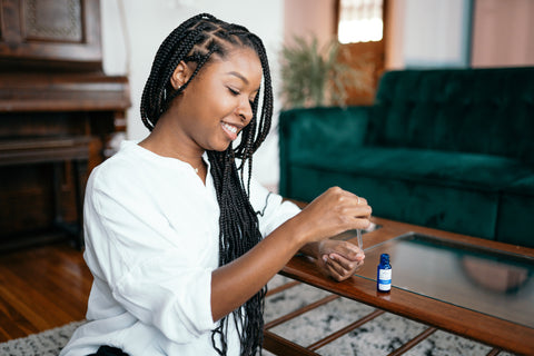 woman using dual defense anti fungal nail care