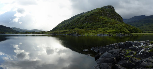 This is a photo by Christophe Meneboeuf available on Wikipedia through Creative Commons. I believe it is the same lake just a different view. In this photo you can see the clouds reflected which tells you it is a body of water, and again, the telltale white line at the horizon.