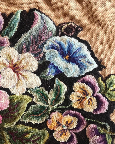 A portion of an unfinished rug resumed to be created in the 20th C. It is hooked by an unknown artist, as well as designed by an unidentified artist. The shading of the flowers features extremely fine details and the wool has been hand dyed in small batches to create each individual color. It is hooked in a #3 count width, which is equivalent to 3/32 of an inch wide.