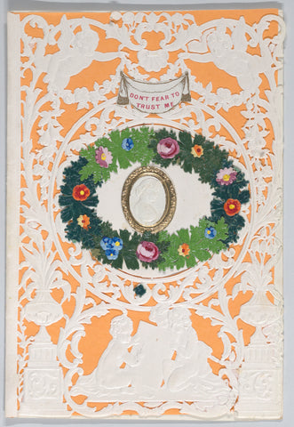 A cut-paper Valentine with a tangerine-colored backing sheet.