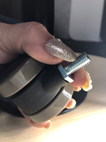 How to hold nut will screwing in caster wheel to base of MojoDesk